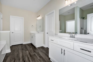 Image of large master bathroom with mirrors and drawers
