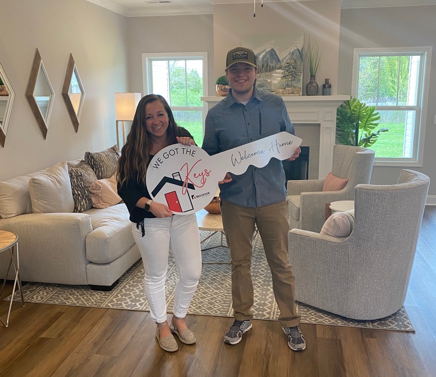 Home builders in Alabama hand over keys to couple's new home